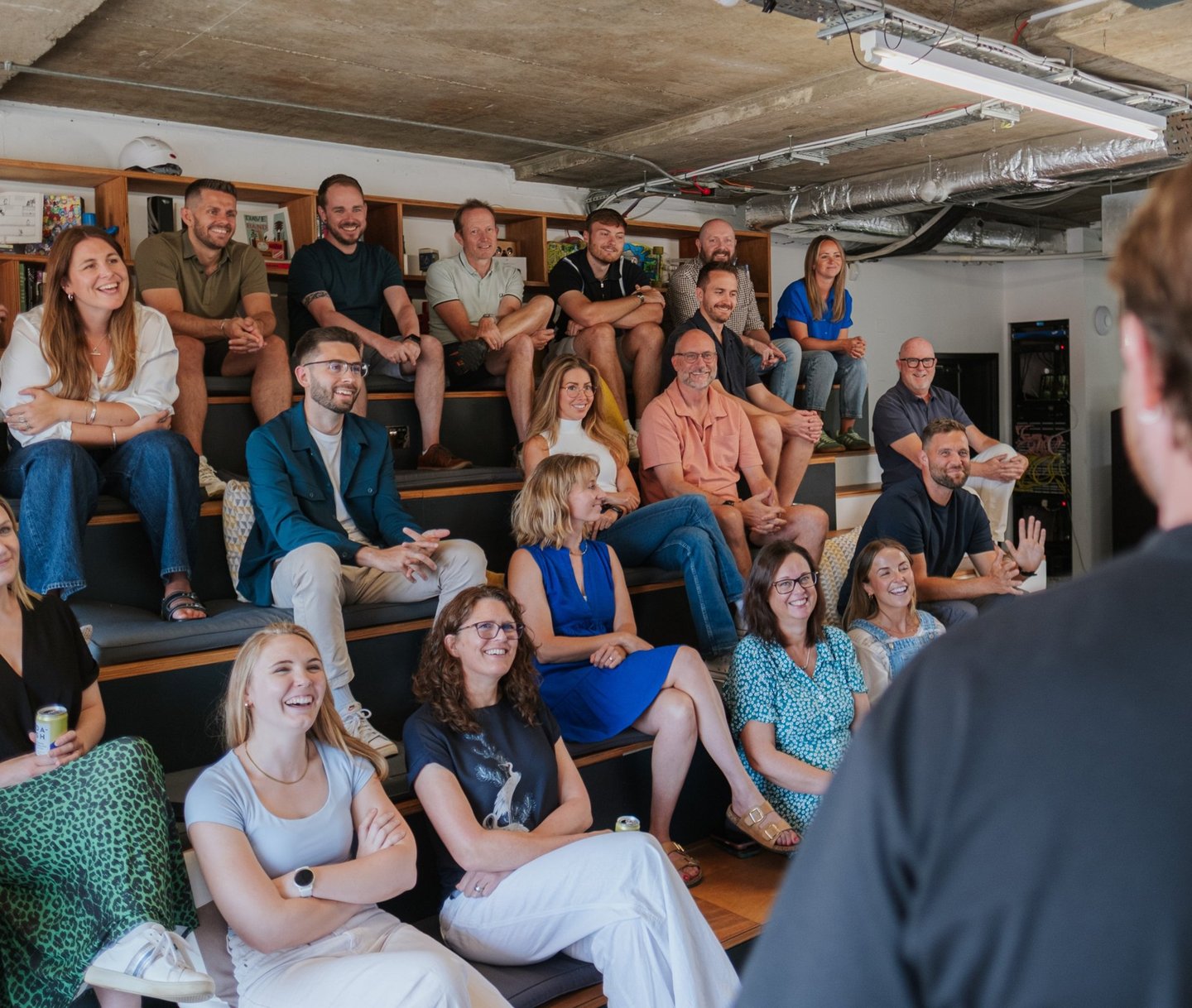 Group on the bleachers during a talk